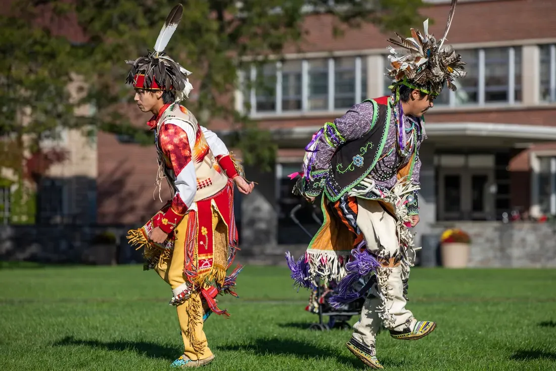 Indigenous dancers celebrating together.